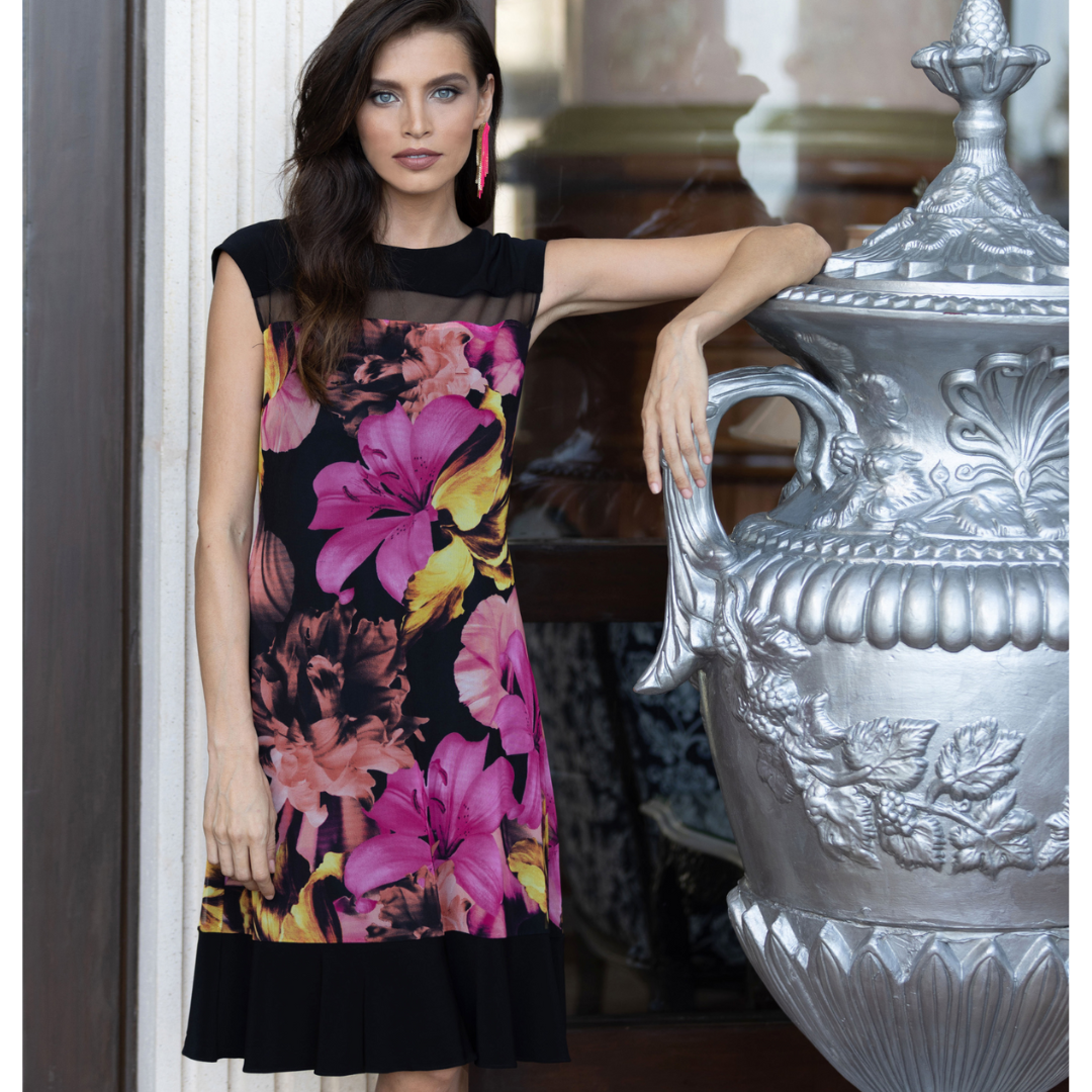 Jaboli Boutique - Fergus Ontario- Frank lyman-Black And Pink Floral Party Dress. Stunning party dress adorned with a beautiful floral print. This knee-length dress with cap sleeves is the perfect choice for summer parties and weddings. The black fabric features pink ,coral, and yellow flowers, adding a vibrant touch to your ensemble.   Black Hemline,  Black Neckline With Sheer Mesh Inlay,And Black Cap Sleeves Frame The Dress Perfectly.Proudly made in Canada.