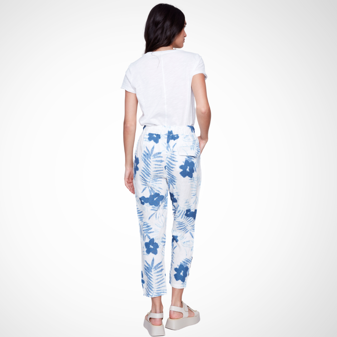 Jaboli Boutique - Fergus Ontario - Charlie B - Linen Print Pants. Charlie B Linen Pant: Pull-on style Color: Refreshing white with blue botanical print Styling options: Pair with coordinating top for a chic jumpsuit look, or with white tee and denim jacket for a casual vibe Features: Drawstring waistband, straight leg cut, and convenient pockets Comfortable and functional for hot summer days Ideal choice for casual yet fashionable outfits
