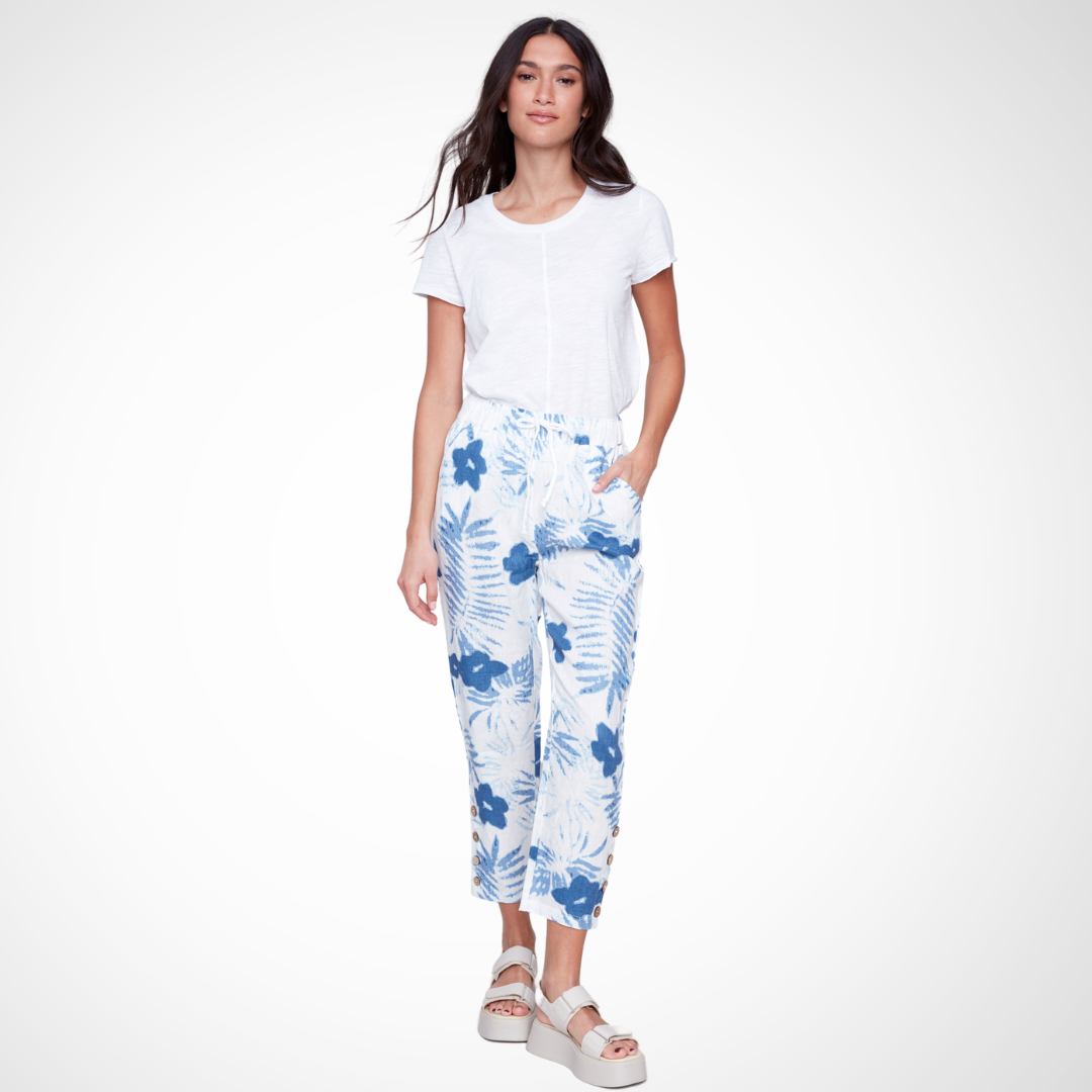 Jaboli Boutique - Fergus Ontario - Charlie B - Linen Print Pants. Charlie B Linen Pant: Pull-on style Color: Refreshing white with blue botanical print Styling options: Pair with coordinating top for a chic jumpsuit look, or with white tee and denim jacket for a casual vibe Features: Drawstring waistband, straight leg cut, and convenient pockets Comfortable and functional for hot summer days Ideal choice for casual yet fashionable outfits