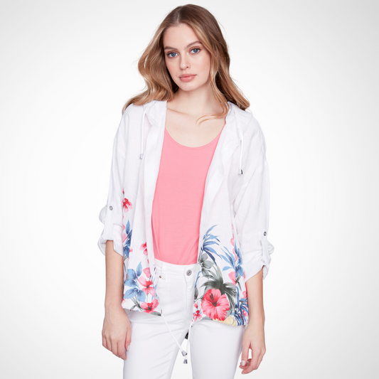 Jaboli Boutique - Fergus Ontario - Charlie B Hooded Jacket.  Transform your summer wardrobe with the Hooded white linen jacket! Features a vibrant tropical print border and an open front Provides both style and functionality Hood and drawstring details at the hem for versatility Tab-up sleeves allow for easy switching between full-length and 3/4 length Pair with the matching tank for a coordinated look Guaranteed to turn heads wherever you go
