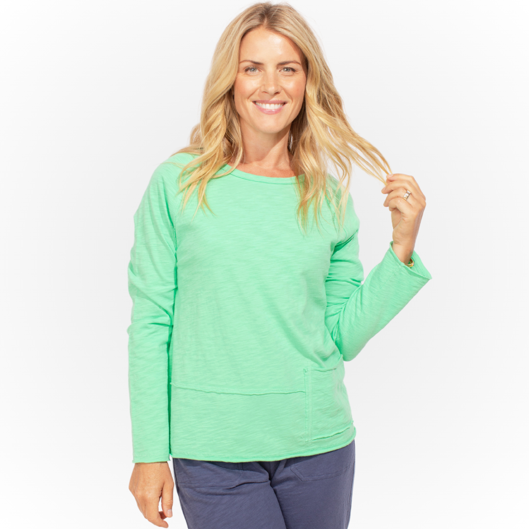 Jaboli Boutique - Fergus Ontario -Escape Pocket Pullover in seafoam adds vibrant color to your wardrobe Classic crew neckline and long sleeves for style and comfort Lightweight cotton slub knit for sun protection during outdoor activities Textured fabric enhances visual interest Hip-length design for versatility in various occasions Seamlessly combines practicality with flair for a breezy allure.