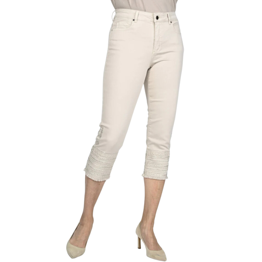 Jaboli Boutique - Fergus Ontario - Frank Lyman - Apricot Capri. High-rise, zip-front, five-pocket stretch denim pant in a neutral light apricot hue. Featuring a cropped, frayed hem with a decorative embroidered or embellished accent.