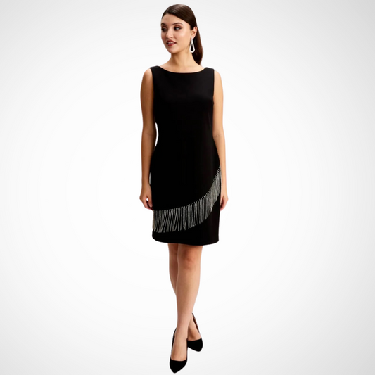 Jaboli Boutique - Fergus Ontario - Frank Lyman  - Black - Rhinestone Fringe Dress. Discover the Beaded Fringe Dress: an updated take on the classic Little Black Dress. Features a striking neckline and chic, sleeveless design for an elegant look. Rhinestone-fringed stripes adorn the skirt at a diagonal angle, adding glamour. Crafted from a luxurious blend of 95% polyester and 5% elastane. Equipped with a sleek back zipper for a seamless fit.