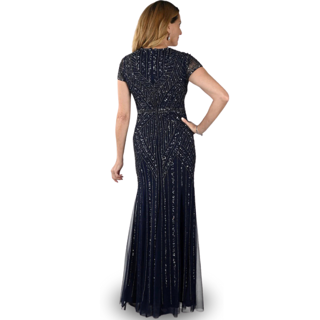 Jaboli Boutique - Frank Lyman - Navy Sequined Gown. A Jaw droppingly gorgeous sequined gown in a flattering navy hue. perfect for mother of the bride or groom. Deep Vee Neckline Colour - Navy Embellished with Pattern of Sequins Cap Sleeve Fitted to Hips, Flowy Bottom Fabulous 'Event' Gown