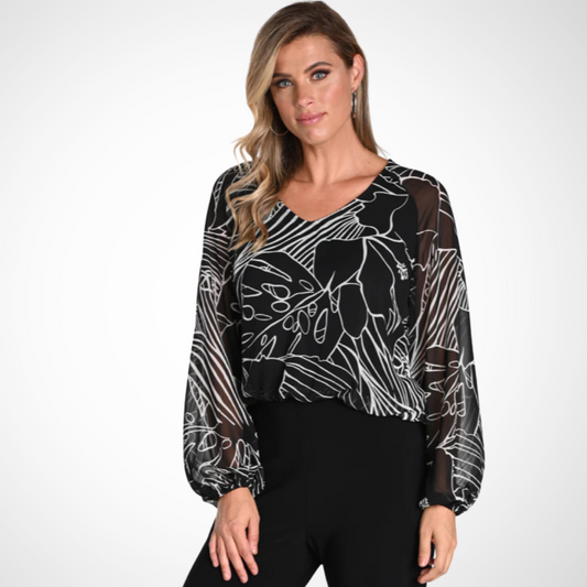  Experience effortless elegance with the Frank Lyman Woven Top, tailored for the modern woman. Combines contemporary flair with classic sophistication in a black and white palette. Meticulously crafted. Flowy silhouette flatters diverse body . 100% polyester with a smooth, wrinkle-resistant texture. Note: No pockets or zipper closure. Style 241244, Made in Canada.