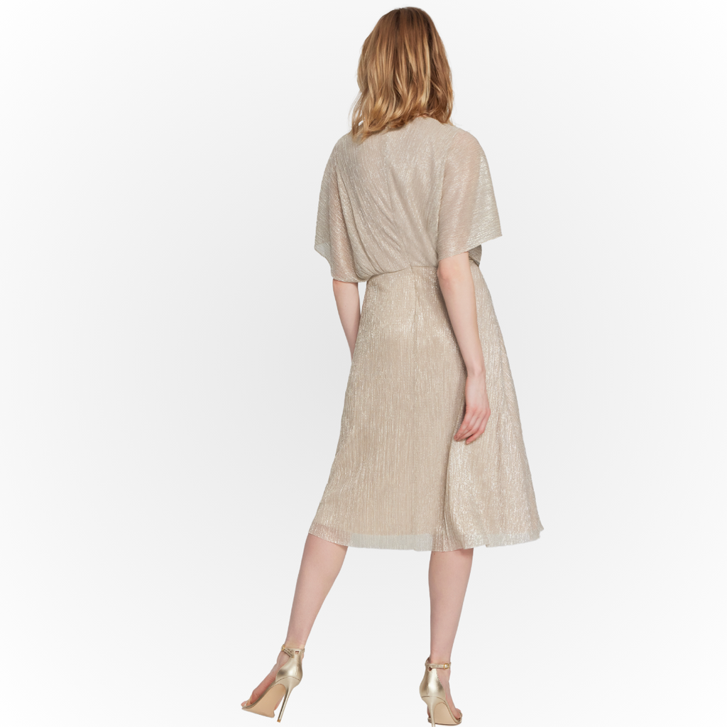 Jaboli Boutique - Fergus Ontario - Joseph Ribkoff Champagne Cocktail Dress. Champagne Shimmer Dress, Cape Shoulder with Faux Wrap Detail, Jewelled accent at waist anchors Vertical Ruffle creates a sliming effect, Cocktail Length, Perfect Mother of the Bride/Groom Dress, Proudly Made In Canada!