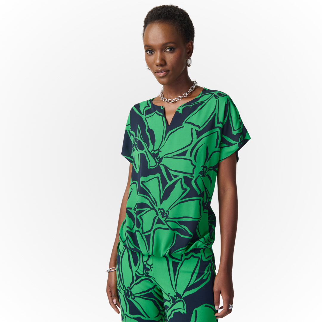 Jaboli Boutique - Fergus Ontario - Joseph Ribkoff Midnight/Green Tropical Top 241059 Notched neckline Colour - Midnight Blue/Green Tropical Print Relaxed Fit Cap Sleeve Light Weight Crepe Fabric with jersey Lined Front Gathered hem in Front, Longer in the Back Proudly Made in Canada! Pair with Coordinating Palazzo Pants for a Great Holiday Outfit!