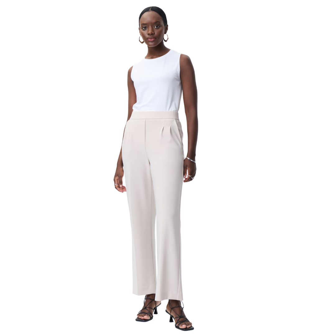 Jaboli Boutique - Fergus Ontario -Joseph Ribkoff - Moonstone Pull On Trouser. Wide Leg Pull On Pant Colour - Moonstone (Light Tan) Pleated Front w Pockets An essential wardrobe piece, these trousers are crafted with a soft, lightweight fabric that is perfect for any season. Tailored with a pleated front and two pockets, these trousers will be your go-to piece no matter the occasion.