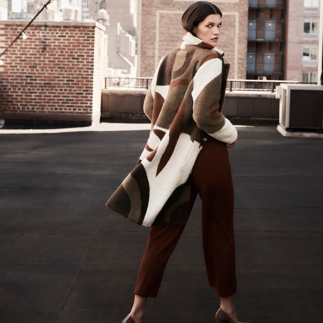 Jaboli Boutique - Fergus Ontario - Joseph Ribkoff - Oversized, Abstract, Cinnamon Coat. Joseph Ribkoff cinnamon coat, thigh-length Oversized fit, straight long sleeves Notched collar, modern abstract pattern Perfect for Fall/Winter; casual yet sophisticated Comfortable, mysterious closure Made of 85% nylon, 15% polyester Side pockets, tuxedo collar Unique cinnamon multi-color