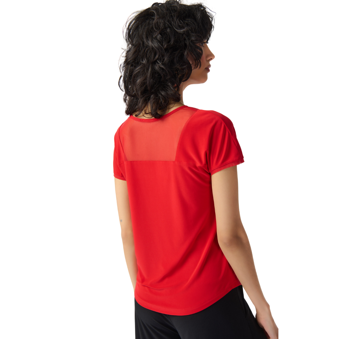 Joseph Ribkoff Red Cap Sleeve Top Jaw-dropping V-neck blouse Mesh inset at neckline for added charm Hip-length design for versatility and flattering fit Crafted from Ribkoff Signature Jersey for comfort and quality Proudly made in Canada, reflecting the brand's commitment to style and craftsmanship.