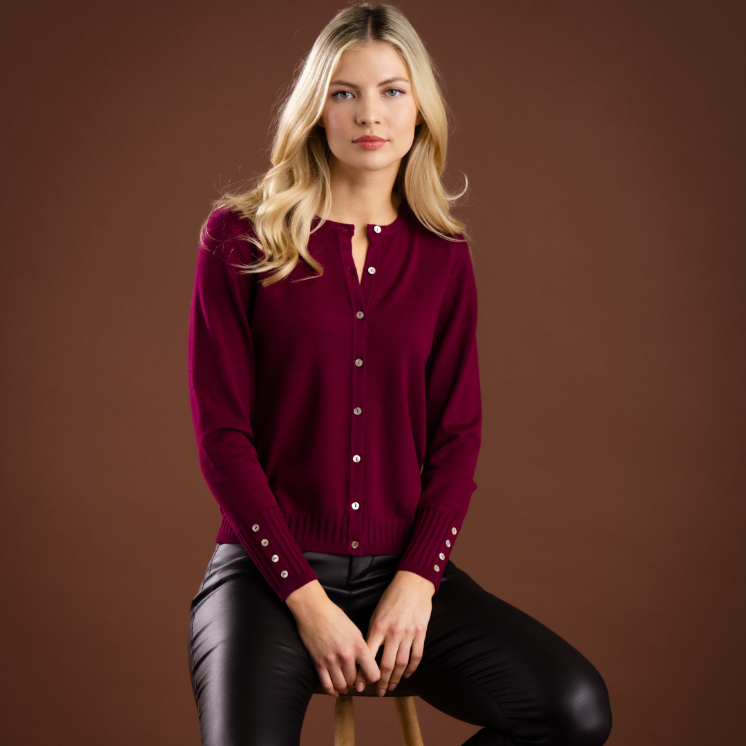 Jaboli Boutque - Fergus Ontario - Marble - Classic Cardigan. Colour Berry/ Beet . Finely Knit Waist Length Cardigan  A Classic Cardigan in the trendy  Berry/ Beet Colour. Pair with our "Ruby" Plaid Pants for a fun Fall/ Winter look that will never go out of style.  Colour - Berry,  Crew Neck,  Button Front,  Button Accent on Cuff.