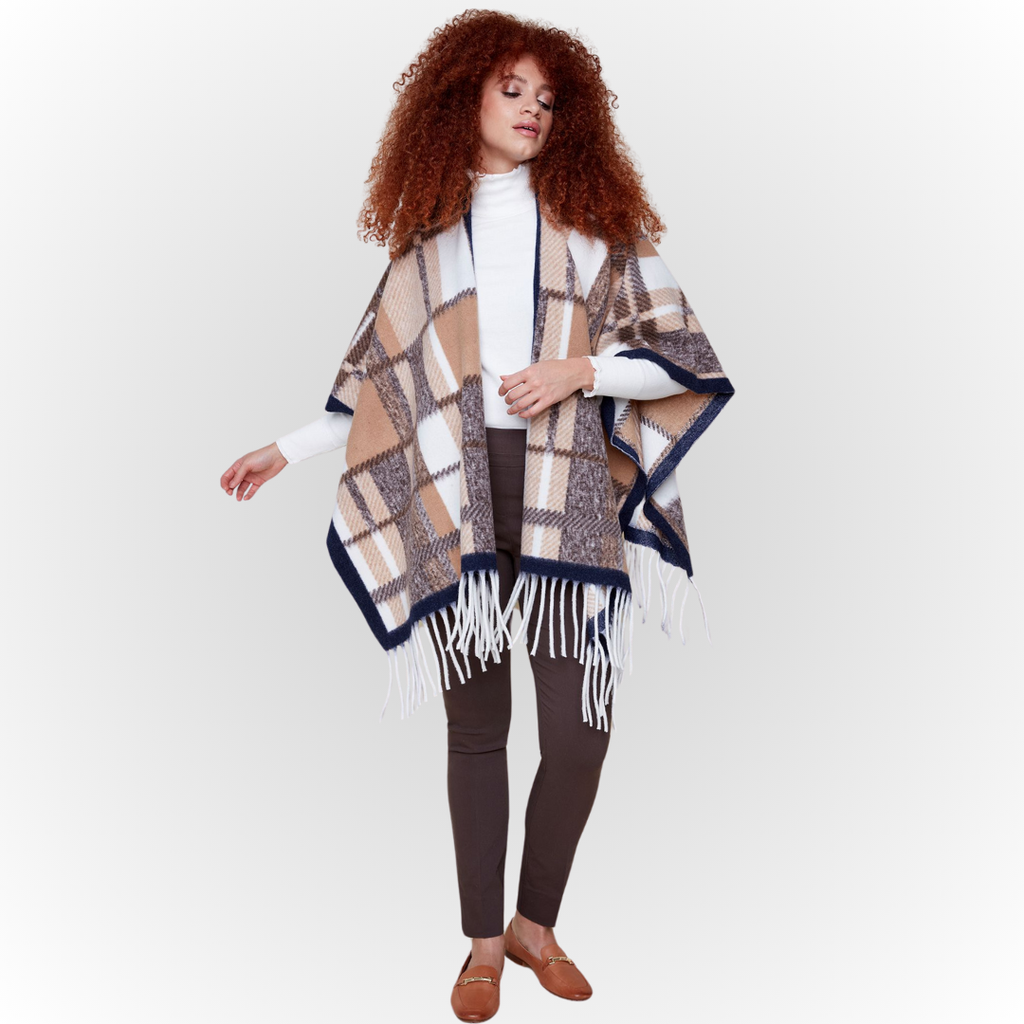 Jaboli Boutique-Fergus Ontario-Renuar-Plaid Poncho - Tan Plaid Poncho for fall Brushed knit plaid print Tan and peacock color combos Fringe hem detail Open front design Made from 100% acrylic One size fits most Stylish and cozy for crisp autumn days