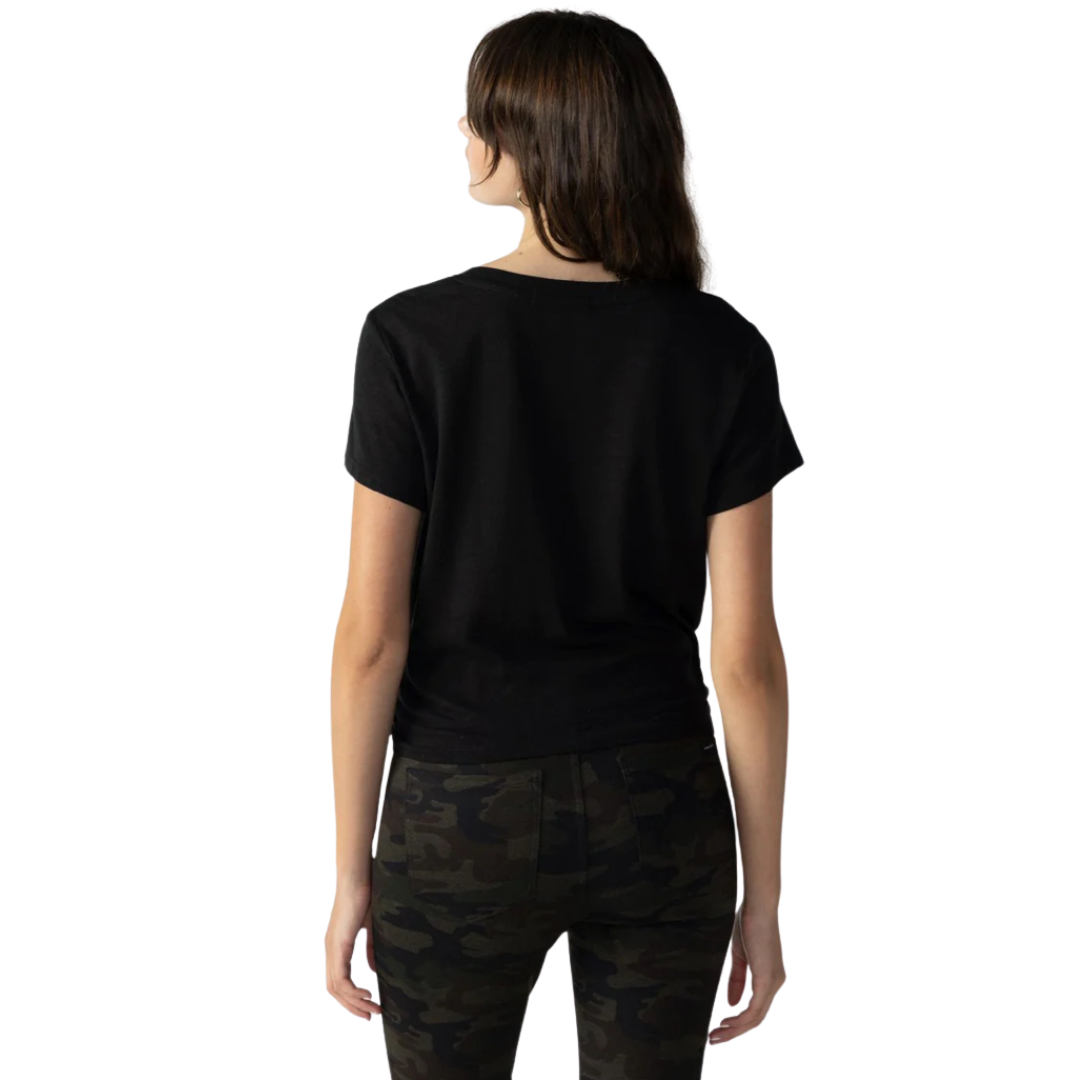jaboli Boutique - Fergus Ontario - Sanctuary Black Highstreet Tee: Fusion of classic and contemporary style Pull-on short-sleeve T-shirt Crew neck and short sleeves for a classic tee look Chic wrap front detail for a fresh and unique touch Crafted from lightweight, sustainably sourced cotton slub Offers a relaxed fit for comfort and style Note: Style runs small, recommend sizing up if between sizes Perfect for elevating your fashion game with a fabulous sense of style