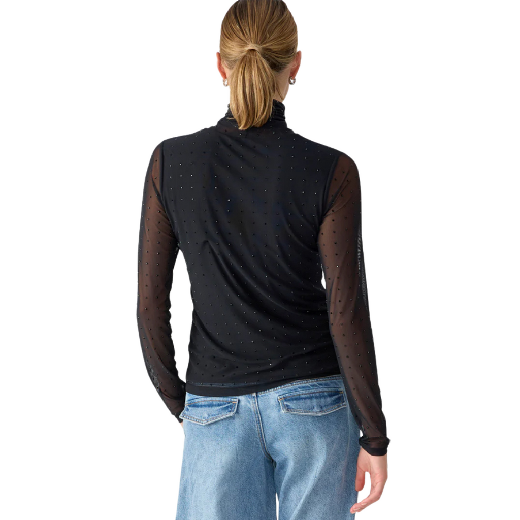 Jaboli Boutique- Fergus Ontario- Sanctuary - Sanctuary Highlight Top: Effortlessly transitions from office to evening events Classic black mock neck with sheer mesh and black rhinestones for glamour Fully lined body for comfort and modesty Long sleeves for a polished and sophisticated look Fitted silhouette achieves a perfect balance of style and elegance Versatile and chic choice for various occasions