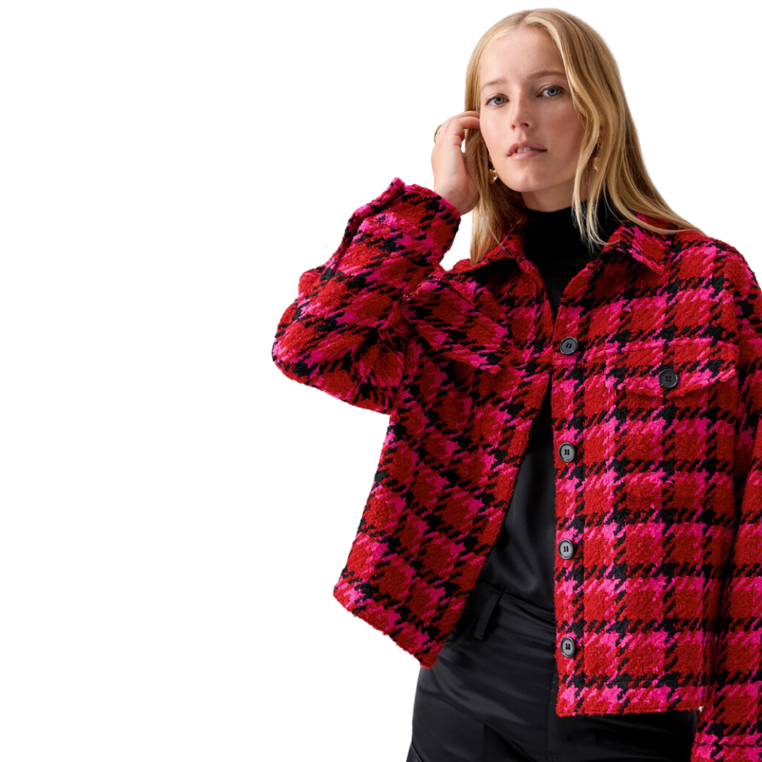 Jaboli Boutique - Fergus Ontario - Sanctuary - Lipstick Red Plaid Jacket. The Cutest Plaid Shacket for adding a pop of color during colder months. Features a waist-length design and a striking Red/Fuchsia/Black Houndstooth Print. Seamlessly combines style and warmth with cozy woven fabric. Offers a relaxed fit for ultimate comfort. Two functional chest flap pockets and four center front buttons for practicality and charm. Ideal choice for staying stylish and snug during the chilly season.