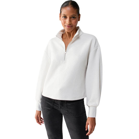 Jaboli Boutique -Fergus Ontario - Sanctuary Sanctuary Quilted Popover: Elegant and chic sweater Ideal for Apres Ski and cozy cottage nights Off White color with geo-textured print Half front zip and long sleeves with cuffs for stylish details Waist-length design for versatility and flattering fit Perfectly pairs with favorite denim Timeless and transitional, suitable for any occasion. Drop Shoulder, Bishop sleeve, sustainable