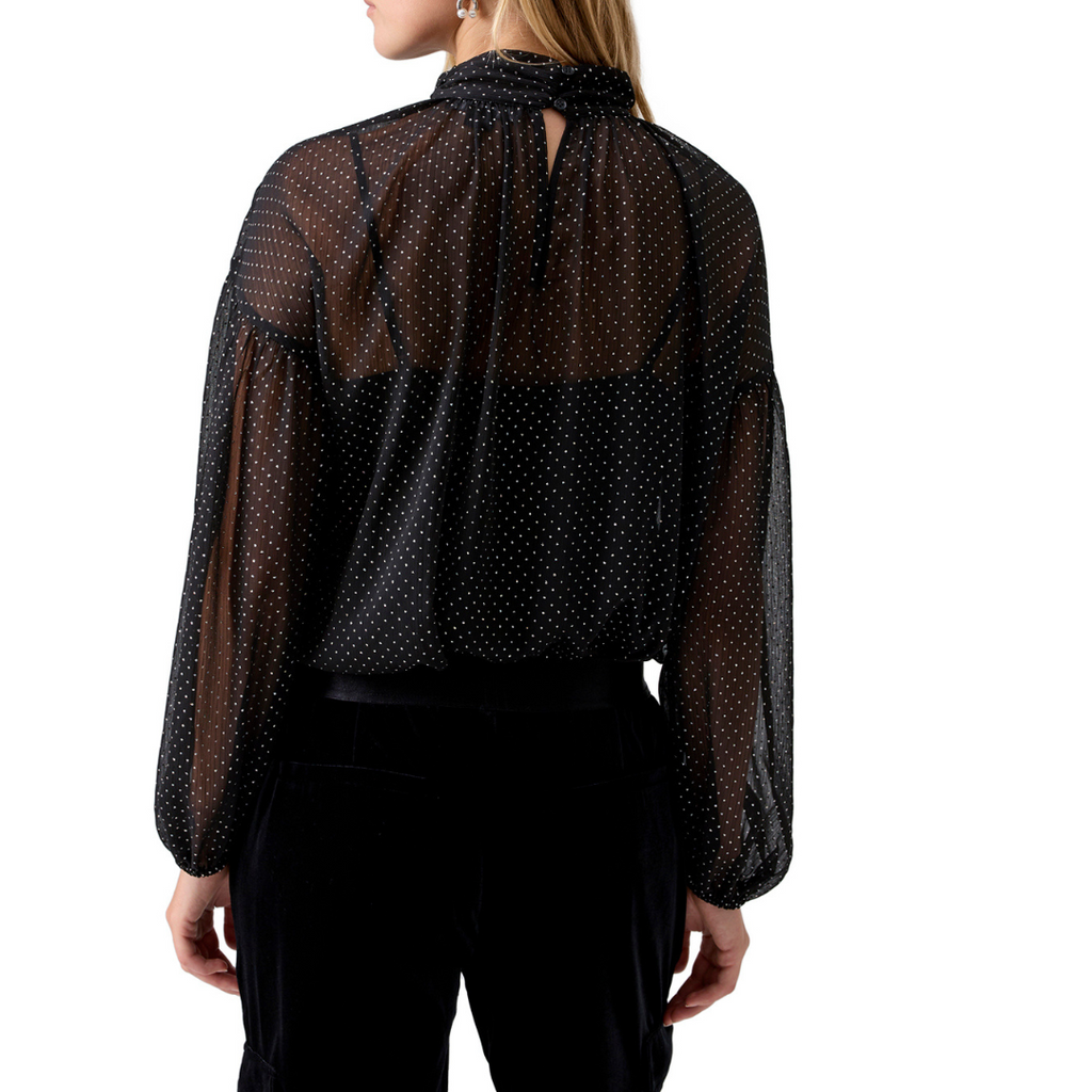 Jaboli Boutique - Fergus ontario - Sanctuary - Sheer Metallic Blouse. The Silver Dot Blouse: Perfect for completing your date night ensemble. Adds a touch of soft feminine charm to your look. Classic Black with Silver Polka Dots exudes timeless elegance. A two-piece blouse that includes a camisole for a chic and comfortable layered style. Features a mock neckline and blouson sleeves for added sophistication. Black blouse with silver dots.