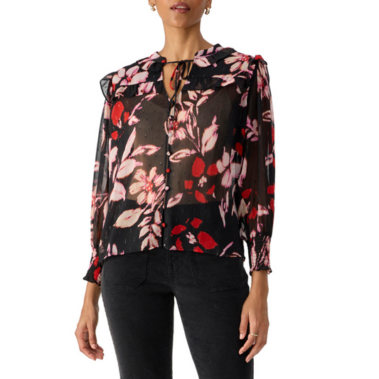 Jaboli Boutique - Fergus Ontario - Sanctuary - Winter Wish Blouse. Winter Wish Blouse: Perfect for your holiday style. Adorned with a stunning poinsettia print for a festive touch of color. Features a charming ruffle collar in a classic Black with Pink and Red Print. Button-front design for a classic and practical element. Long sleeves with ruched cuffs add sophistication to the look. Ideal for holiday parties and special occasions. 