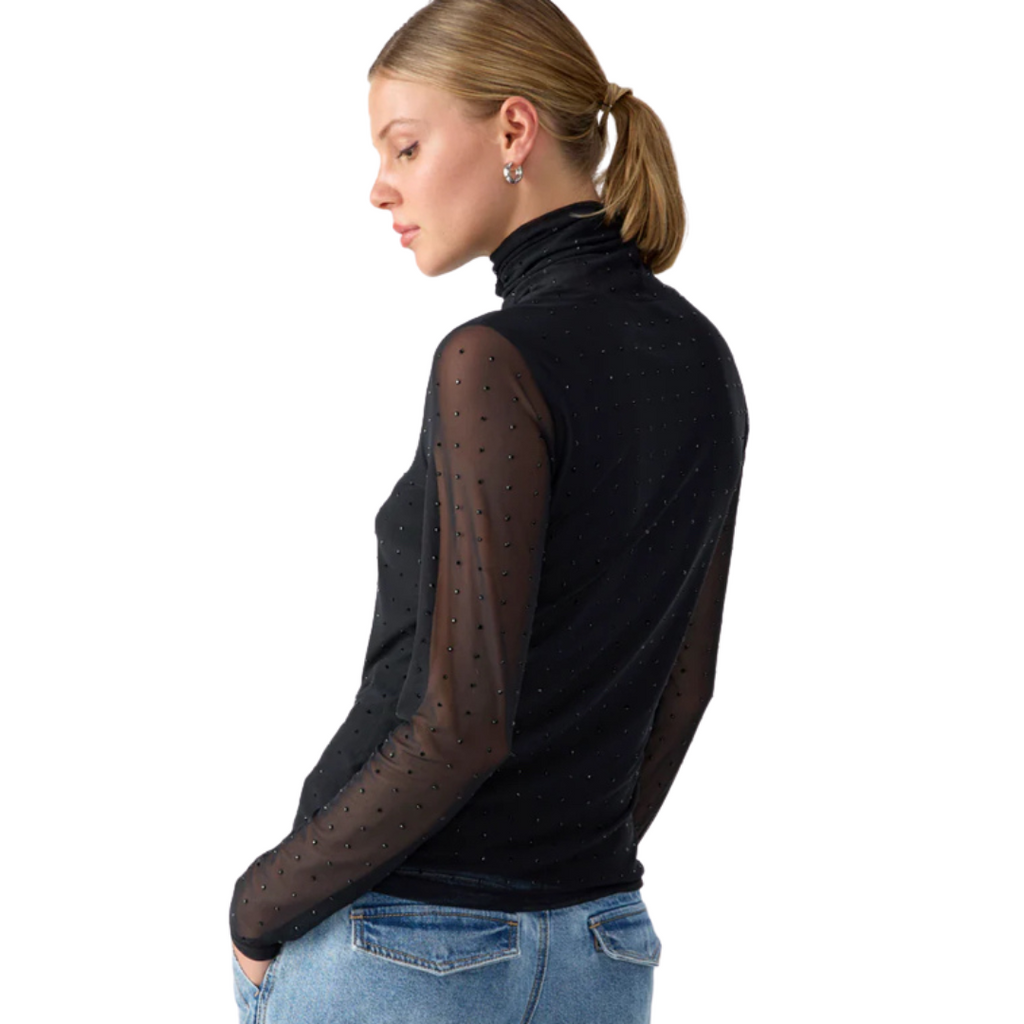 Jaboli Boutique- Fergus Ontario- Sanctuary - Sanctuary Highlight Top: Effortlessly transitions from office to evening events Classic black mock neck with sheer mesh and black rhinestones for glamour Fully lined body for comfort and modesty Long sleeves for a polished and sophisticated look Fitted silhouette achieves a perfect balance of style and elegance Versatile and chic choice for various occasions