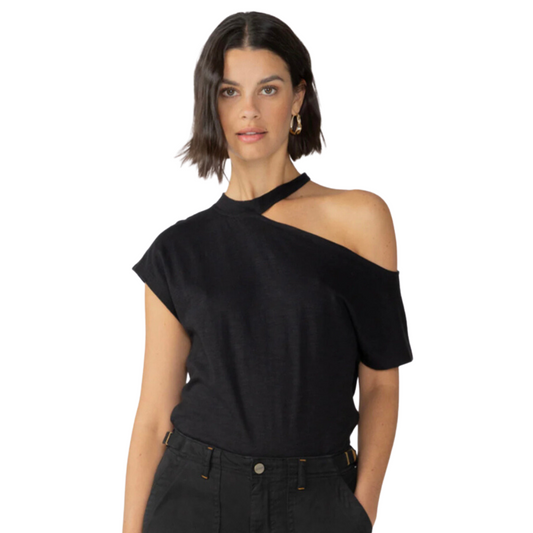 Jaboli Boutique - Fergus Ontario - Sanctuary Part Time Lover Tee Shirt, Black. A sustainable soft knit tee featuring a shoulder-baring cutout that is both edgy and eye-catching. One Shoulder on, One Shoulder off Colour Black Waist Length Cutouts create a modern shape that will turn heads. The soft, breathable fabric provides comfort and sustainability to match your style.