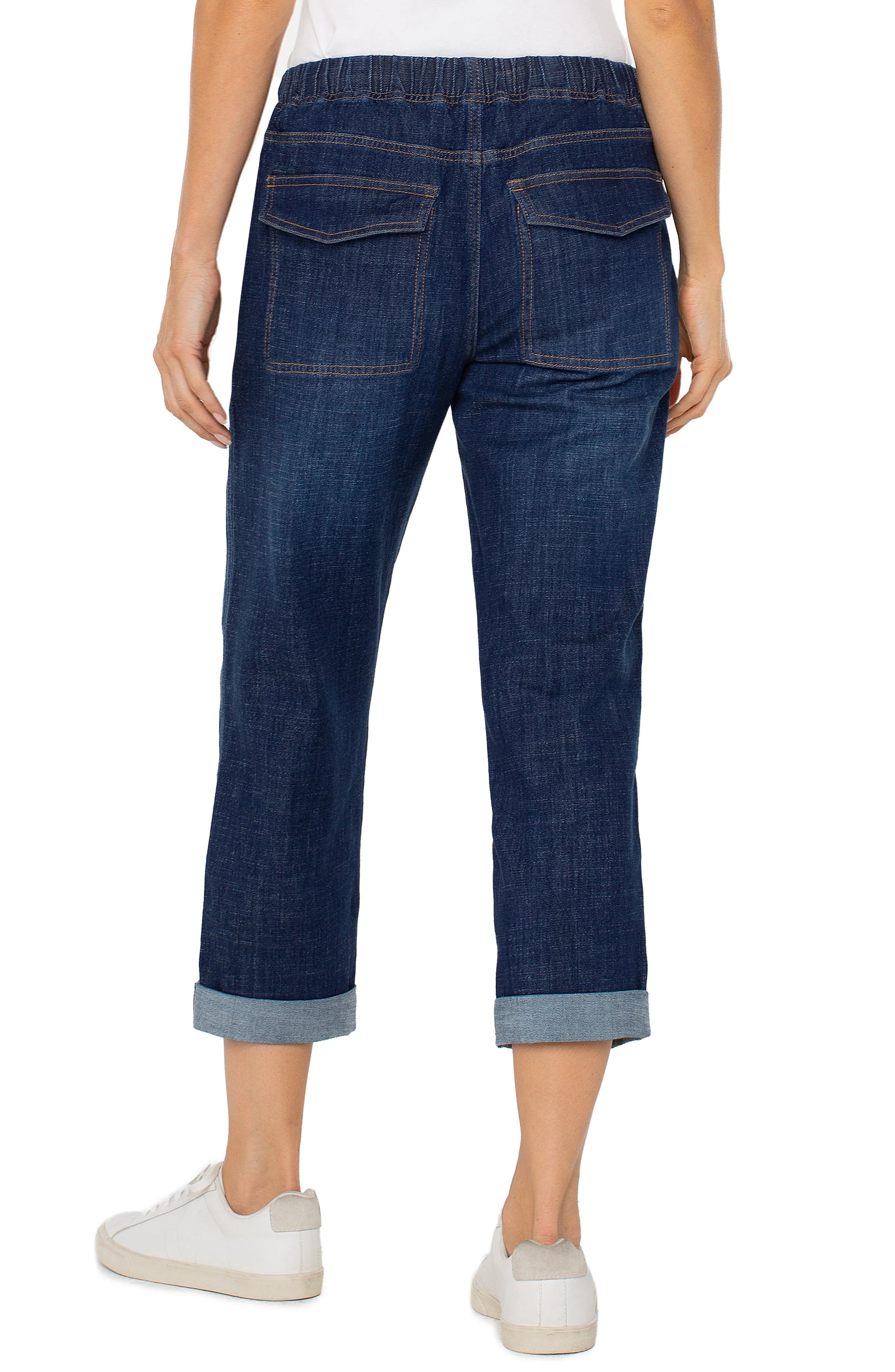 Jaboli Boutique-Fergus Ontario-Liverpool- Rascal Jean-relaxed-fit cargo pants in a soft  woven Gabriel Blue(dark indigo), featuring a pull-on design with an elastic waistband, belt loops, and adjustable drawstring waist. Pants have four utility-style pockets, subtle stitch detailing, and a low-rise silhouette. Shown rolled at 24" inseam, with an option for full 27" length. Made from breathable 100% cotton, offering a roomy fit through the hips and thighs.