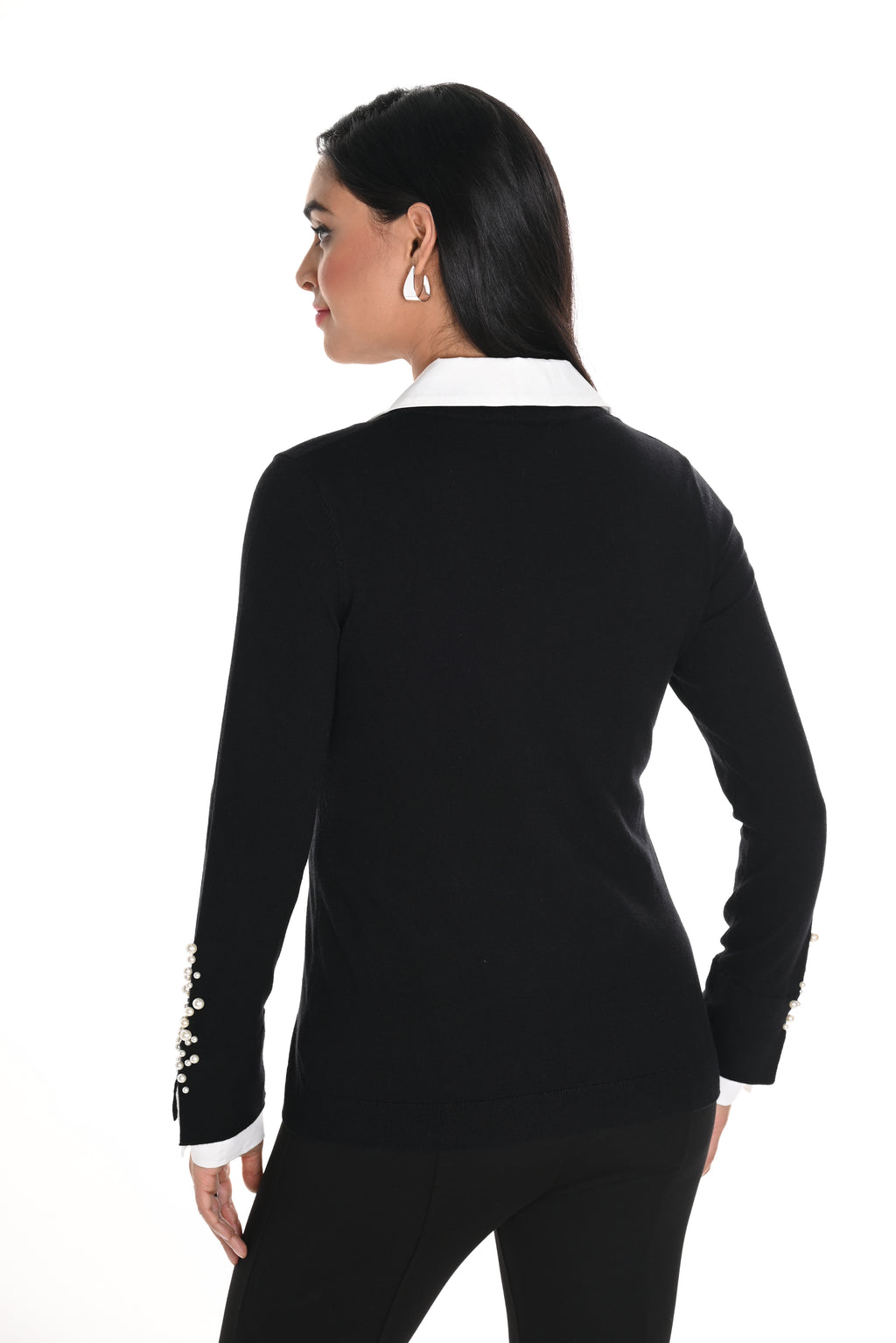  Jaboli Boutique-Fergus Ontario-Pearl Fooler Top-244627U-colour black-This Frank Lyman sweater showcases a sleek black body with a v-neck design, a shirt-style collar, and long sleeves adorned with pearl-encrusted cuffs. Its hip-length, regular fit makes it ideal for work or special events, offering a touch of elegance with layered pearls and timeless style. Crafted from a 50% Rayon, 30% Polyester, and 20% Polyamide blend, it combines comfort and sophistication effortlessly.