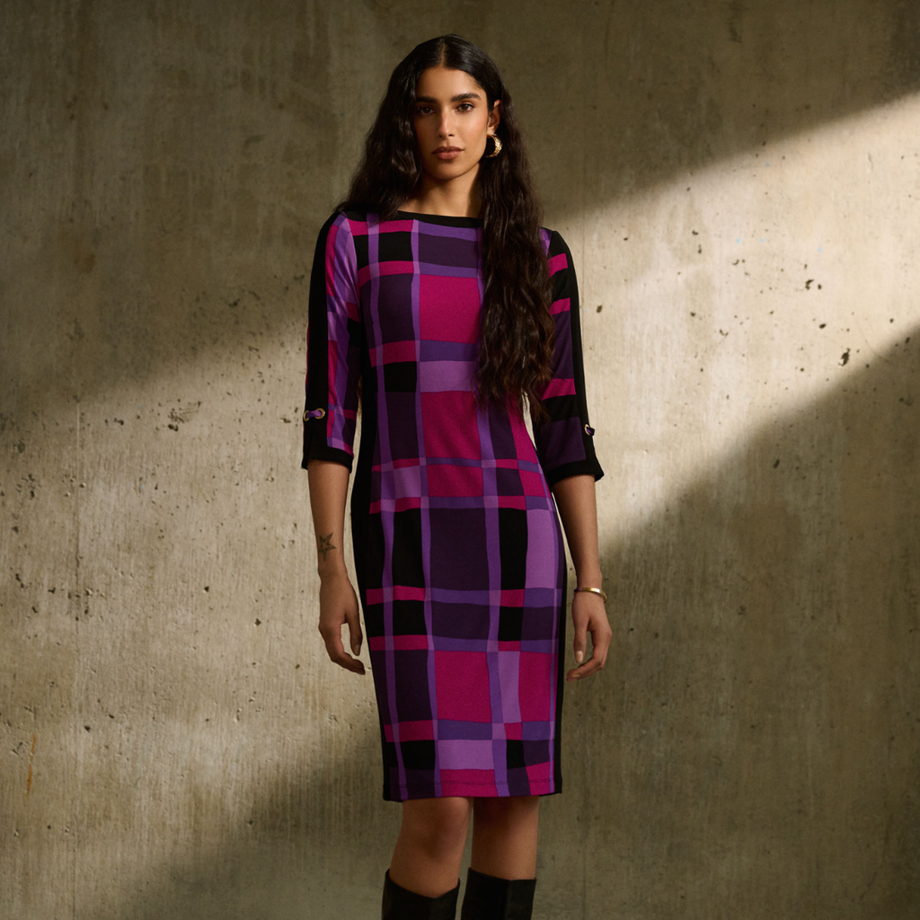 Joseph Ribkoff Geometric Dress Shades of purple, pink, and black Cocktail length, midi pencil skirt Slimming black side panels Elegant grommet details Comfortable blend: 95% polyester, 5% spandex Back zipper for easy wear Perfect for stylish transformations