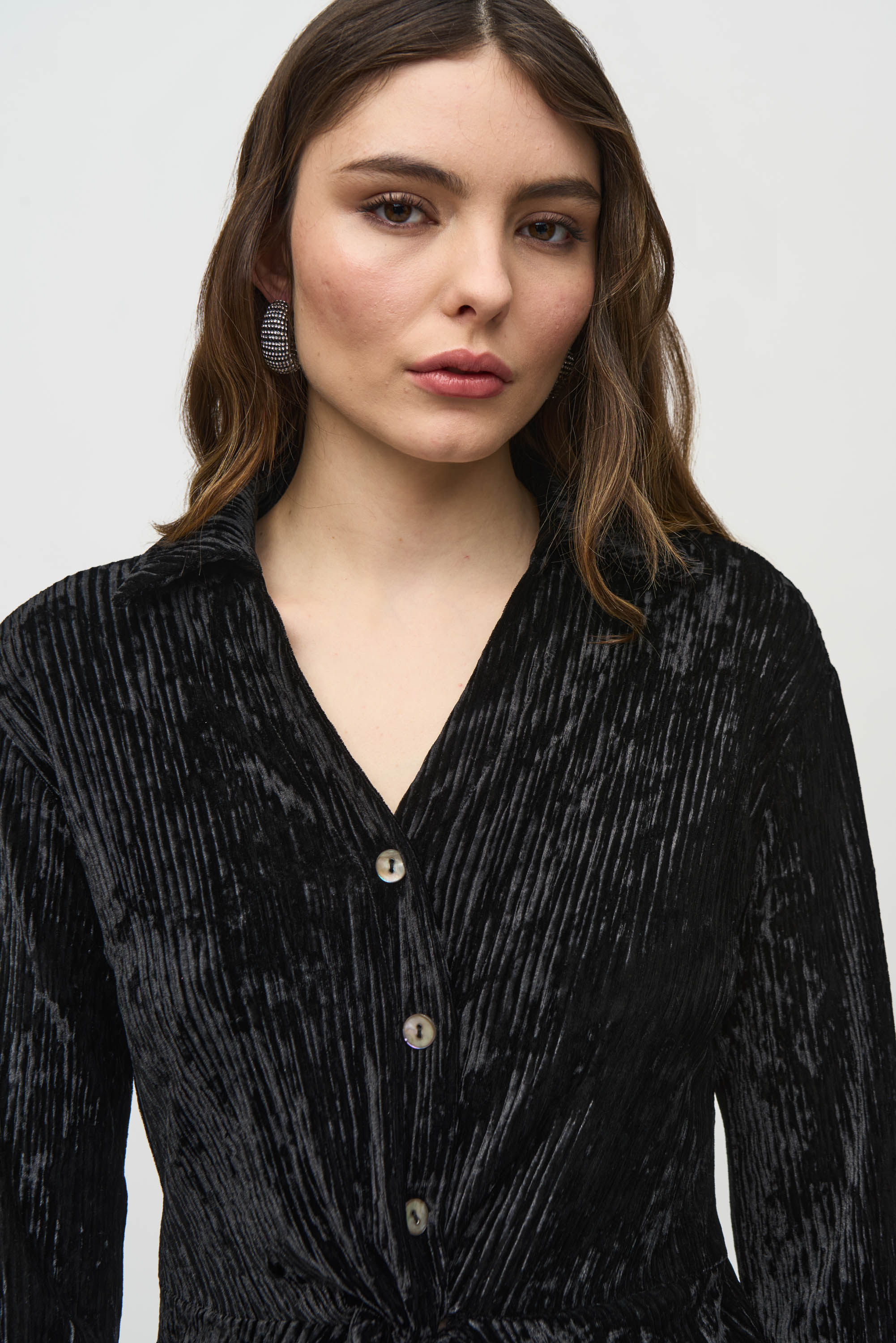 Jaboli Boutique- Fergus Ontario-Joseph Ribkoff Crushed Velvet Party Top
 Style # 244156
Flattering V-neckline
Black color
Long sleeves with faux button closure
Peplum front for a chic, waist-length look
Perfect for casual, semi-formal, or evening events
92% Polyester, 8% Spandex