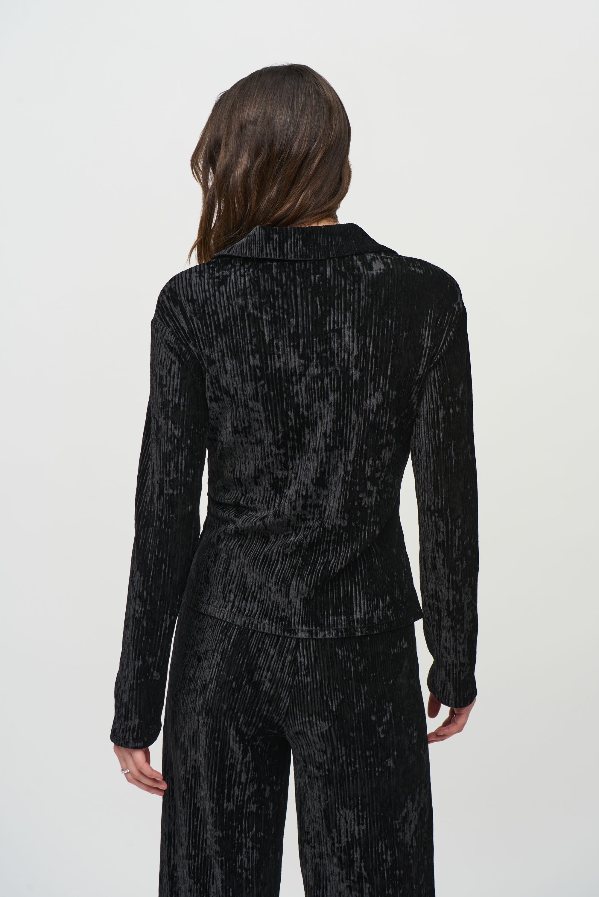 Jaboli Boutique- Fergus Ontario-Joseph Ribkoff Crushed Velvet Party Top
 Style # 244156
Flattering V-neckline
Black color
Long sleeves with faux button closure
Peplum front for a chic, waist-length look
Perfect for casual, semi-formal, or evening events
92% Polyester, 8% Spandex