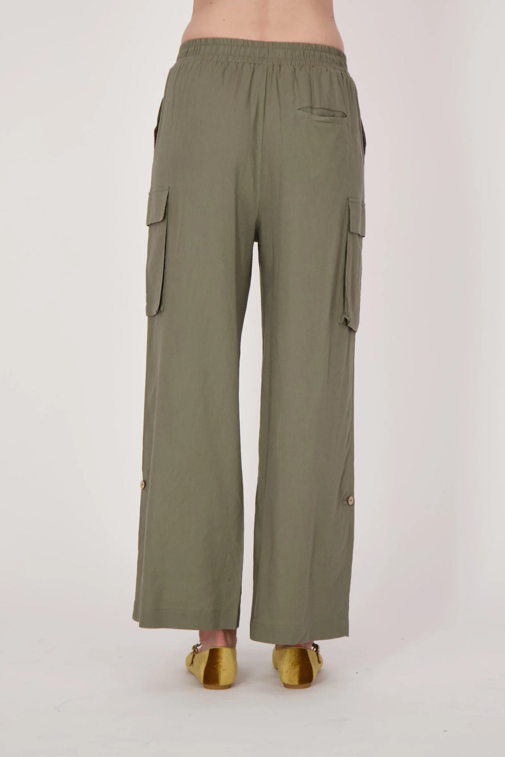 Jaboli Boutique- Fergus Ontario-Spanner - wide leg cargo pant. Olive green wide leg cargo pants with a relaxed fit, made from a lightweight rayon-linen blend. Features an elastic pull-on waistband, four pockets, and adjustable tab-up hems at the ankles.