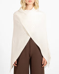 Angela Mara | Poor Boy Shrug 31075
Cropped ribbed shoulder shrug sweater in Winter White and Espresso, with soft knit texture and minimalist silhouette for layering.
