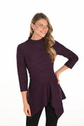 Jaboli Boutique|Fergus Ontario| Frank Lyman | Knit Plum Tunic| 253247
Frank Lyman deep plum textured knit tunic with mock neck, 3/4 sleeves, asymmetric hem, back zip detail, and fit-and-flare silhouette