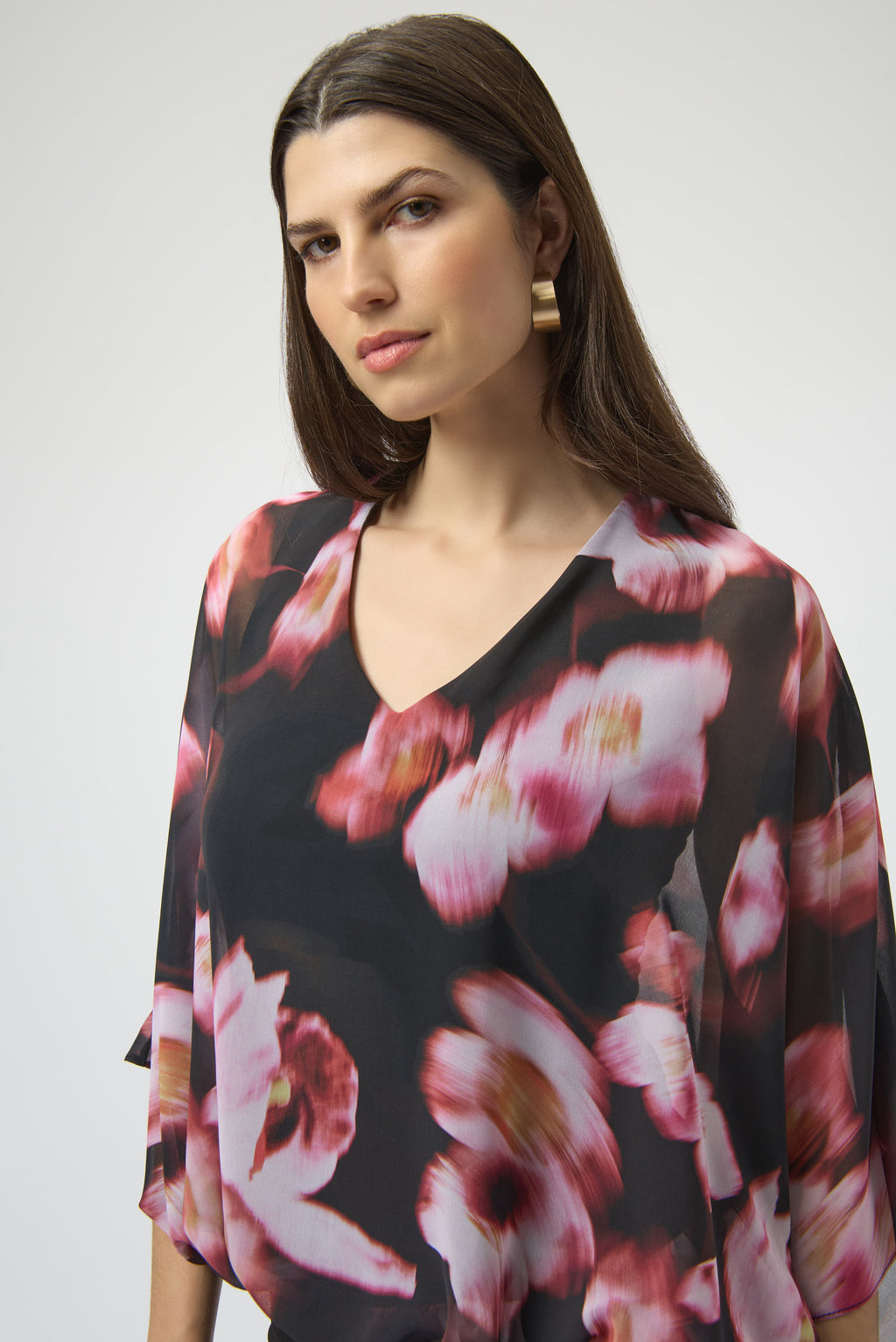 Jaboli Boutique|Fergus Ontario|Joseph Ribkoff | Chiffon Silky Knit Floral Print Cape Top| Joseph Ribkoff black chiffon cape top with pink and rose floral print, featuring V-neckline, dolman sleeves, silky knit waistband, and back bow detail. 100% polyester
