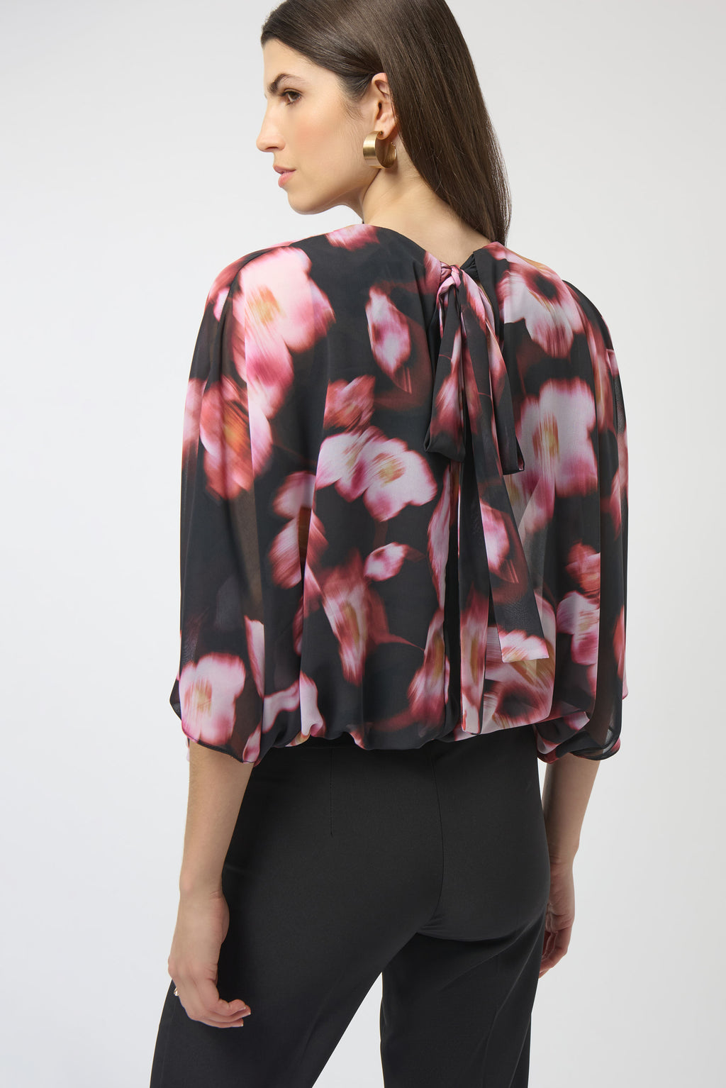 Jaboli Boutique|Fergus Ontario|Joseph Ribkoff | Chiffon Silky Knit Floral Print Cape Top| Joseph Ribkoff black chiffon cape top with pink and rose floral print, featuring V-neckline, dolman sleeves, silky knit waistband, and back bow detail. 100% polyester