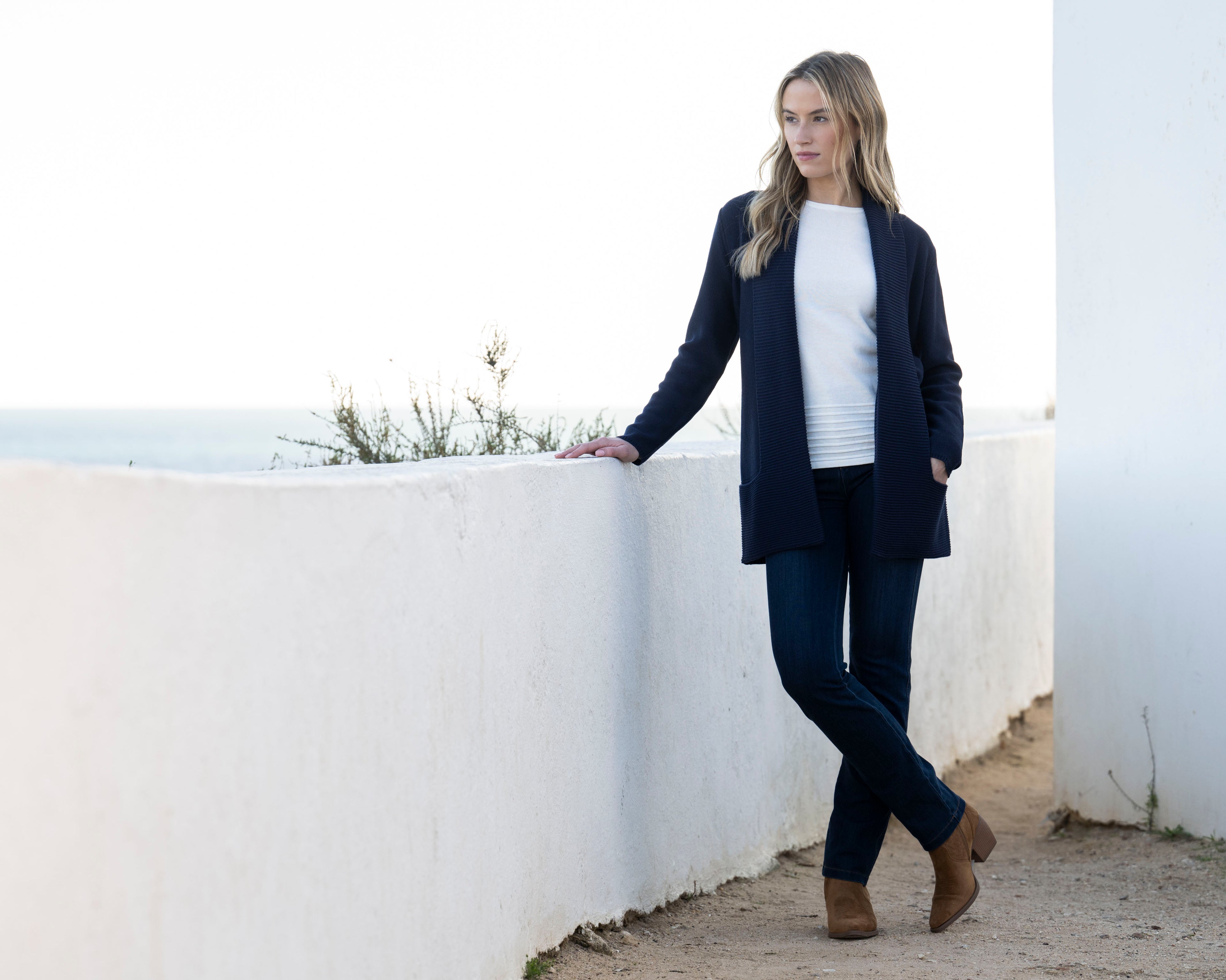 Jaboli Boutique | Fergus Ontario| Marble | Classic Cardigan. Colour Navy.
Marble Classic Cardigan with shawl collar, long sleeves, thigh-length relaxed fit, and pockets, in navy and cognac, perfect for layering over office or casual outfits.