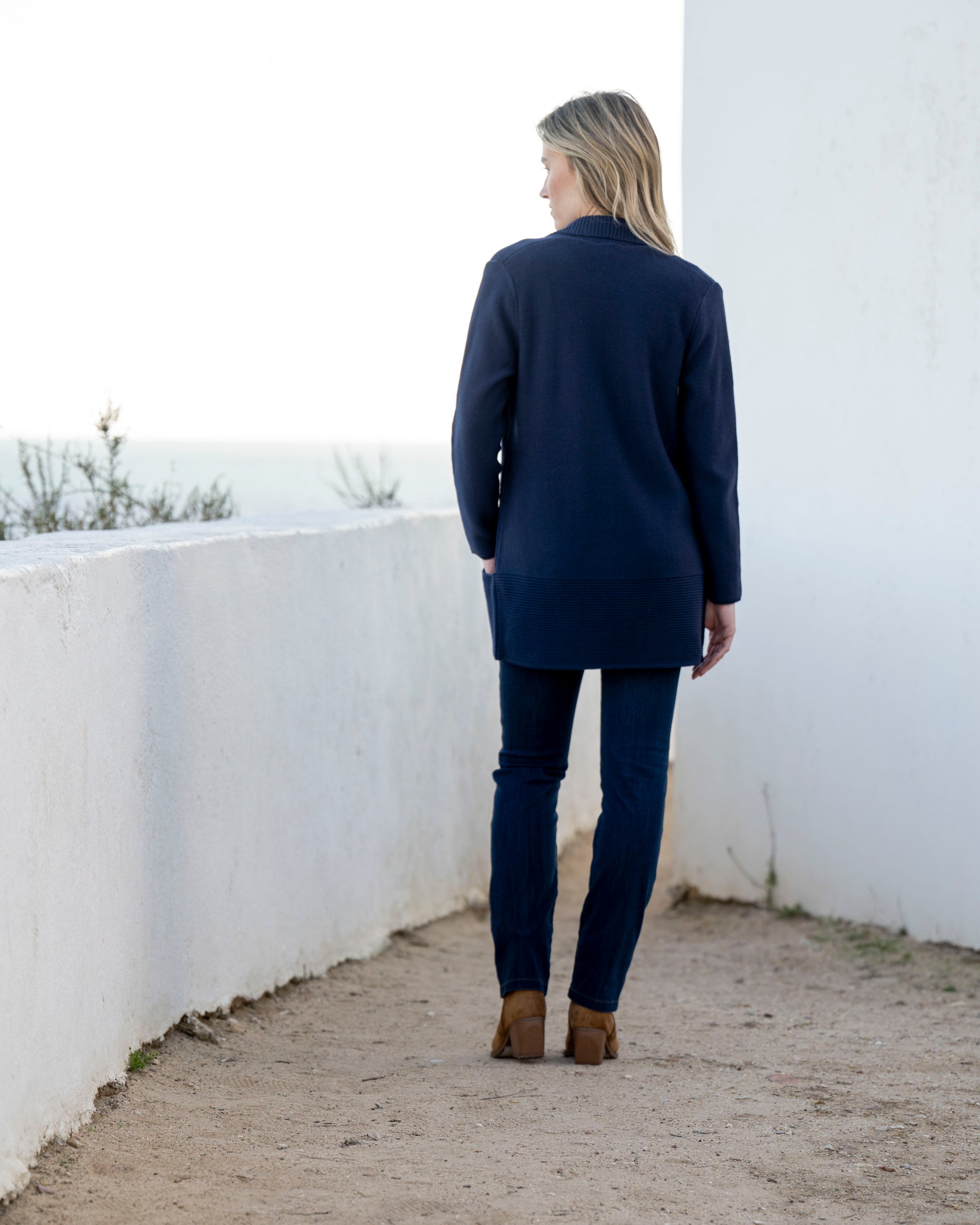 Jaboli Boutique | Fergus Ontario| Marble | Classic Cardigan. Colour Navy.
Marble Classic Cardigan with shawl collar, long sleeves, thigh-length relaxed fit, and pockets, in navy and cognac, perfect for layering over office or casual outfits.