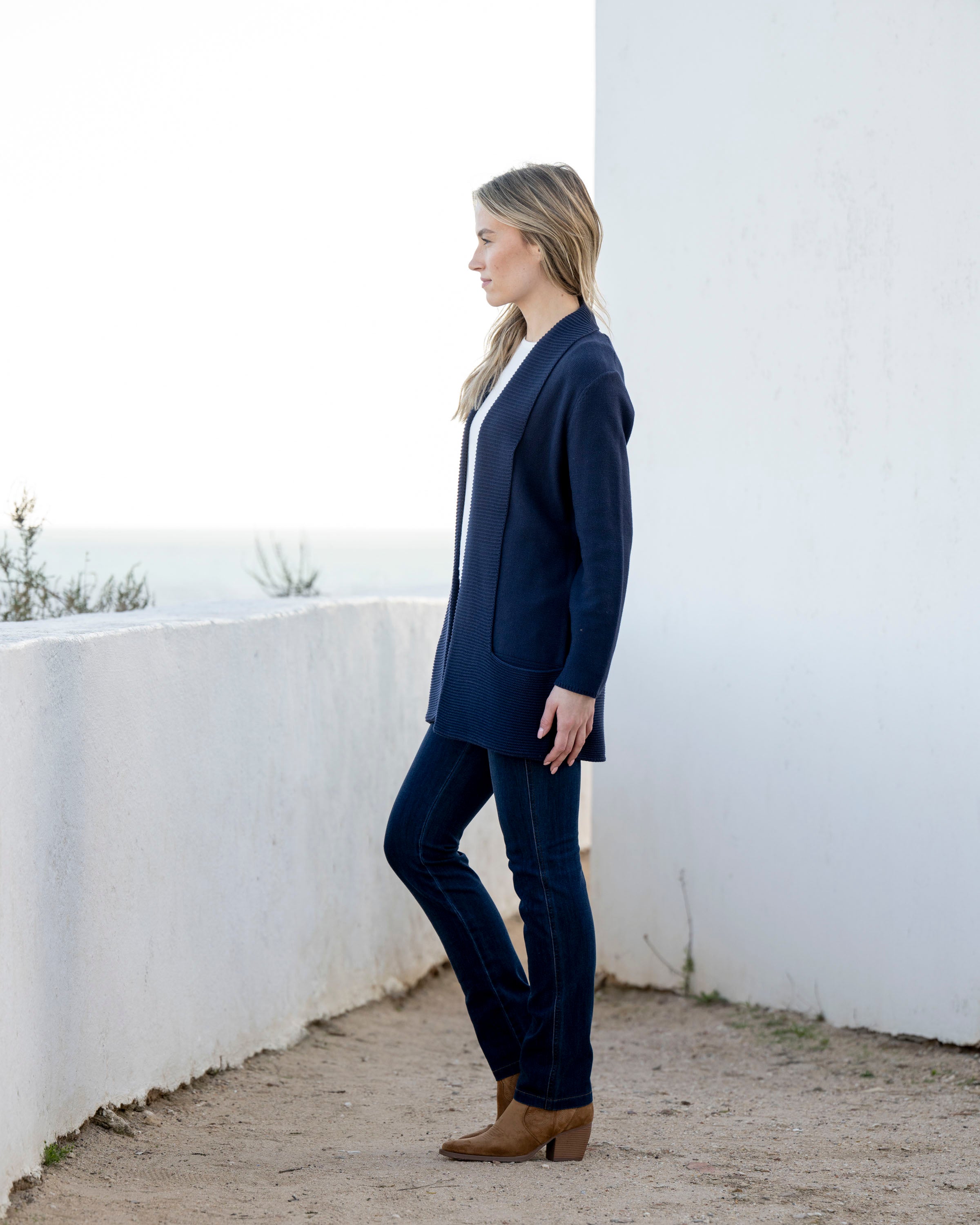 Jaboli Boutique | Fergus Ontario| Marble | Classic Cardigan. Colour Navy.
Marble Classic Cardigan with shawl collar, long sleeves, thigh-length relaxed fit, and pockets, in navy and cognac, perfect for layering over office or casual outfits.