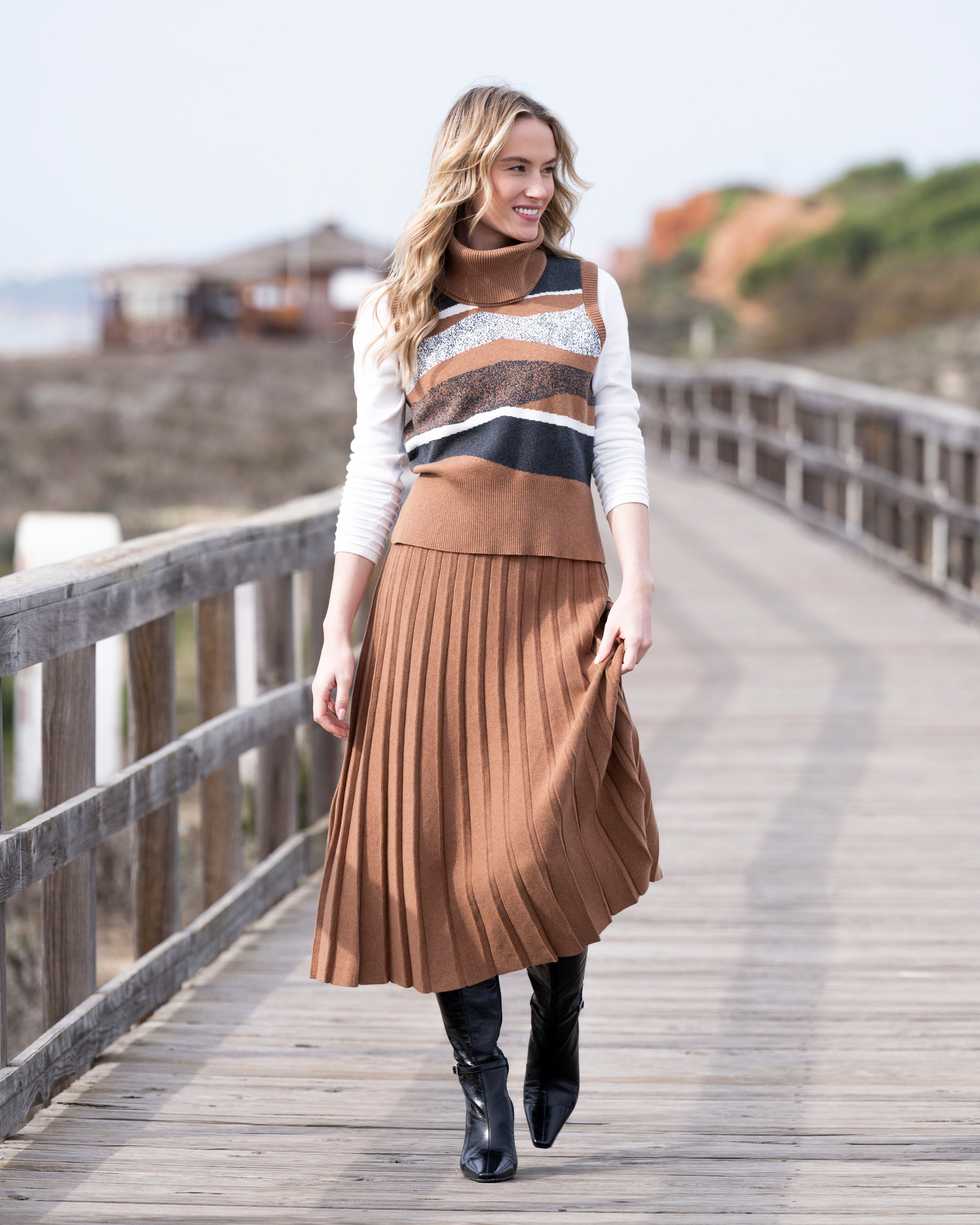 Jaboli Boutique | Fergus Ontario| Marble pleated knit skirt in cognac, pull-on style with a comfortable waistband and elegant midi length. Classic pleats create movement and a refined silhouette, perfect for work or casual chic