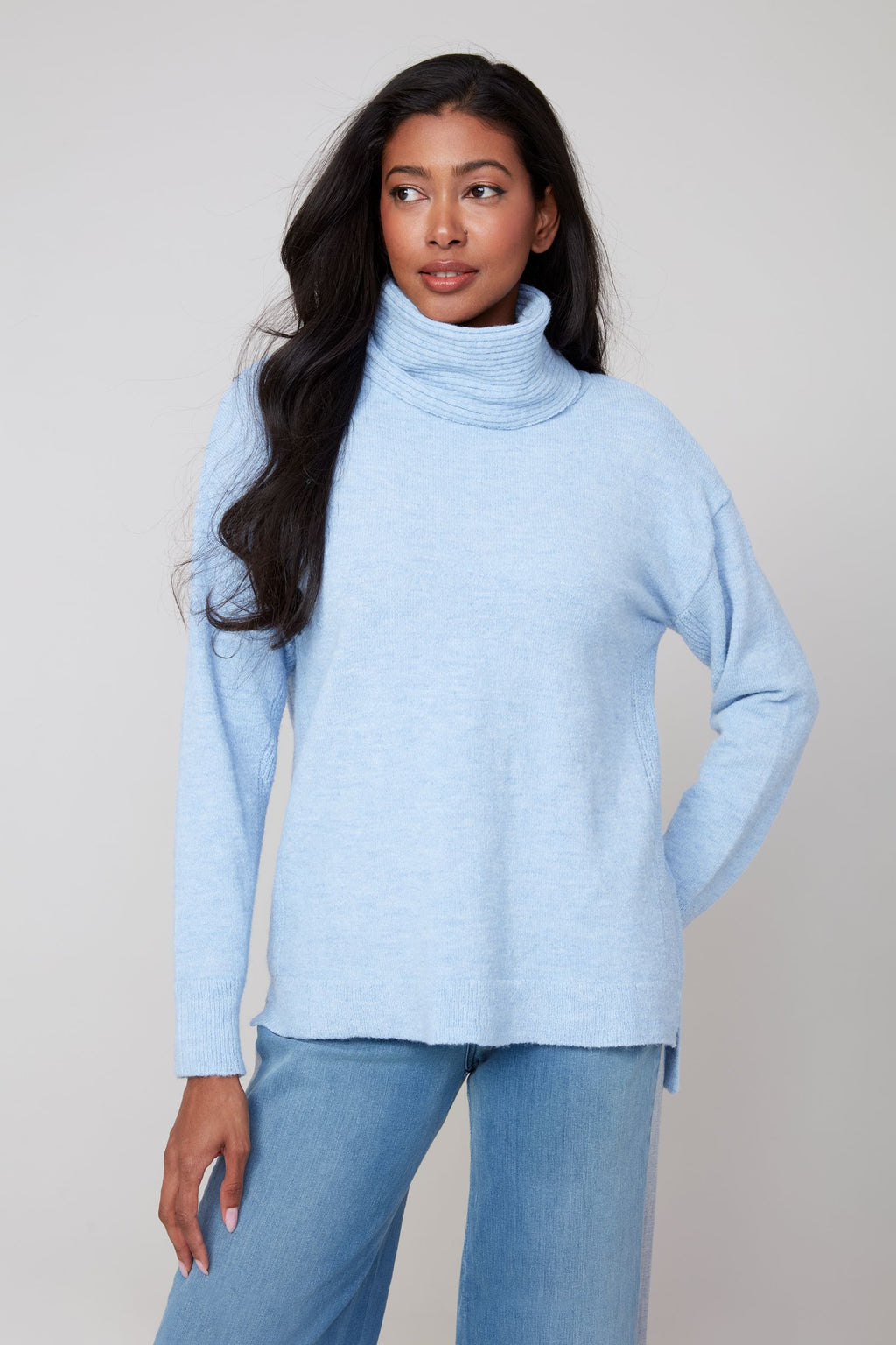 Jaboli Boutique | Fergus Ontario | Renuar | Oxford Blue Cashmere-Feel Knit Sweater.
Renuar women’s pullover sweater in a deep Oxford Blue colour, featuring a relaxed cowl neckline that drapes softly. Made from a cashmere-feel knit fabric, the sweater has long sleeves and a comfortable, relaxed fit designed for cozy layering. The style is versatile for casual or office wear, shown paired with denim and sneakers for a laid-back fall outfit, or with tailored trousers and loafers for a polished winter look.