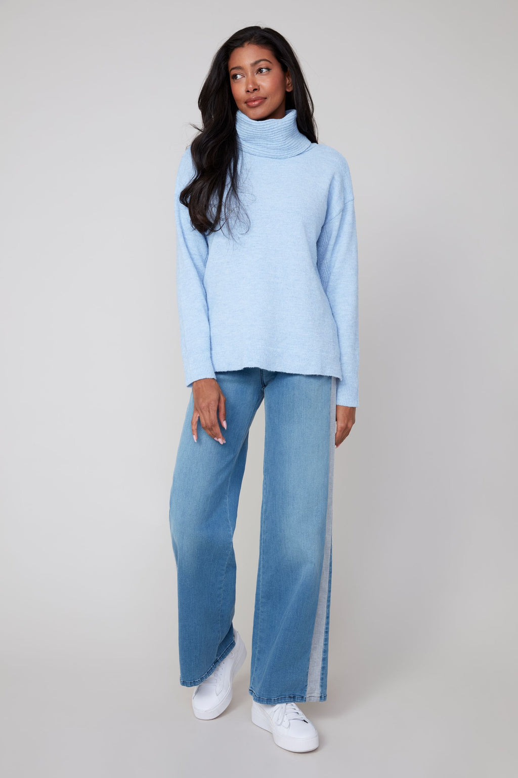 Jaboli Boutique | Fergus Ontario | Renuar | Oxford Blue Cashmere-Feel Knit Sweater.
Renuar women’s pullover sweater in a deep Oxford Blue colour, featuring a relaxed cowl neckline that drapes softly. Made from a cashmere-feel knit fabric, the sweater has long sleeves and a comfortable, relaxed fit designed for cozy layering. The style is versatile for casual or office wear, shown paired with denim and sneakers for a laid-back fall outfit, or with tailored trousers and loafers for a polished winter look.