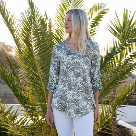 Jaboli Boutique - Fergus Ontario - Marble Khaki Lime Tunic.  Marble Khaki/Lime Tunic Features a Palm print Hemline comes to a point, reflecting the V neckline Scoop Neck design Color: Khaki with Lime and White Print 3/4 Sleeve with Ruched Detail at Elbow Relaxed Fit Tunic Length