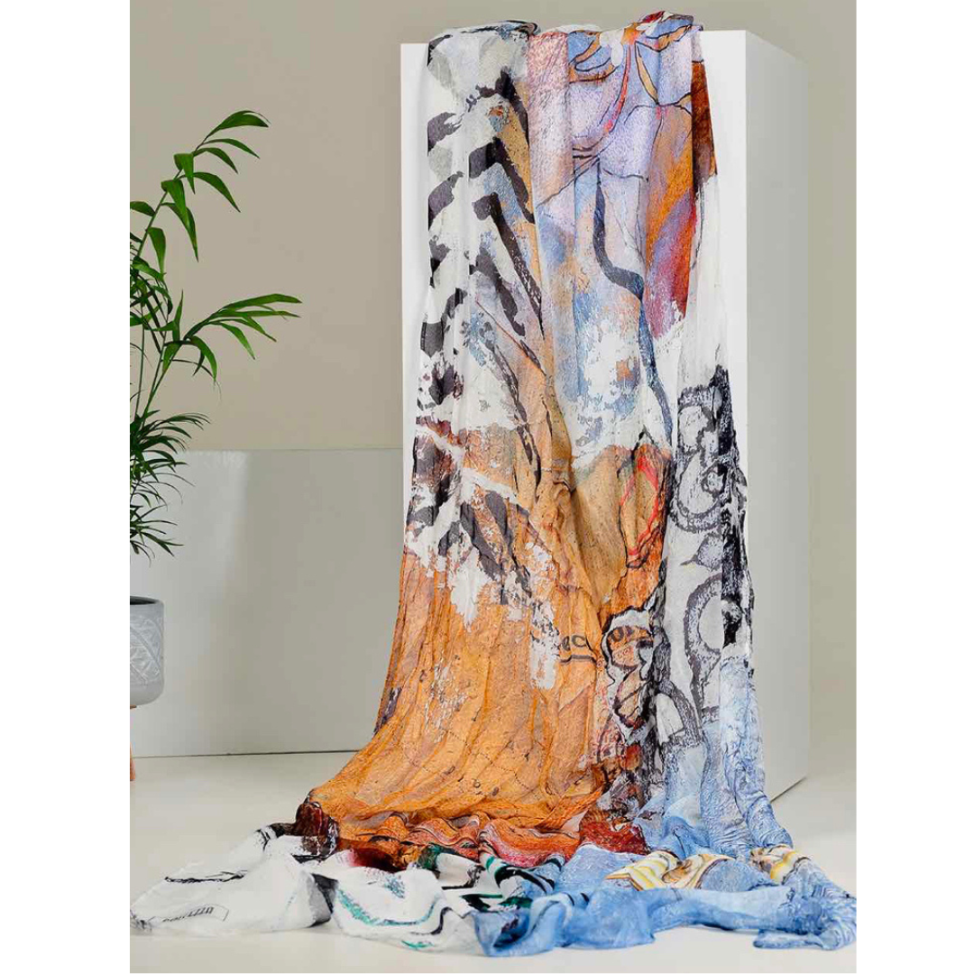 Jaboli Boutique - Fergus Ontario - Dolcezza - Good Enough Print. Rich Golds , sky blues, beiges and black make up this stunning abstract print. Crafted from premium 100% Viscose fabric, the Dolcezza Art Scarf showcases a captivating collection of assorted art prints.  A Gorgeous Summer Accessory 