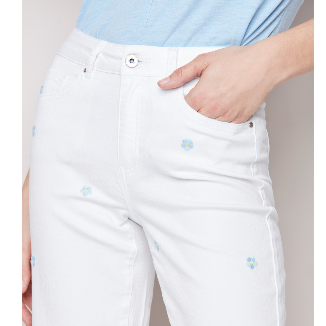 Jaboli Boutique - Fergus Ontario - Charlie B - Embroidered Flower Cropped Jeans White Denim High Rise Fly Front Wide Leg Frayed Hem. Emroidered Flowers Are Light Powder Blue with Yellow Centers